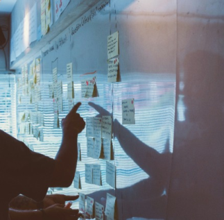 person-pointing-at-kanban-board