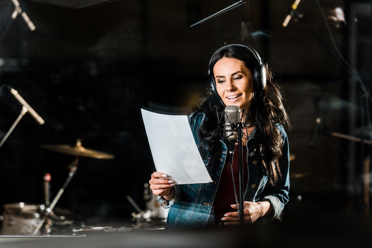 beautiful-woman-in-headphones-singing-in-recording-2023-11-27-05-36-56-utc Large