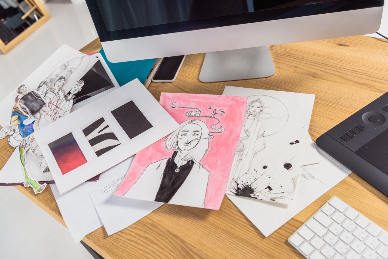 work-place-of-designer-with-drawings-and-computer-2023-11-27-05-21-59-utc Large